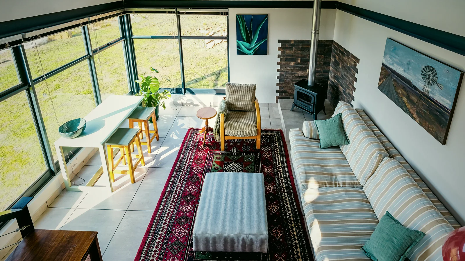 Living room, dining table and stairs to the loft